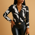 Women’s black and white printed elegant blouse with lightly tailored fit and classic design, suitable for business meetings and formal occasions.