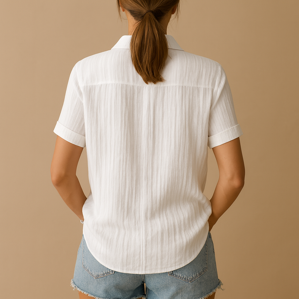 Classic short sleeve blouse for women in white with relaxed fit and chest pocket, ideal for office wear, casual outfits and warm days.