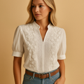 Elegant white blouse for women with a classic collar and button closure, suitable for work, leisure, and evening occasions.