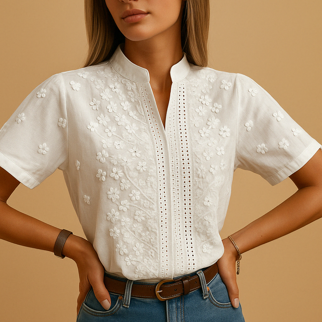 Elegant white blouse for women with a classic collar and button closure, suitable for work, leisure, and evening occasions.