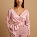 Women’s elegant pink wrap blouse with adjustable tie waist and long sleeves, suitable for office wear, formal occasions, and chic daily outfits.