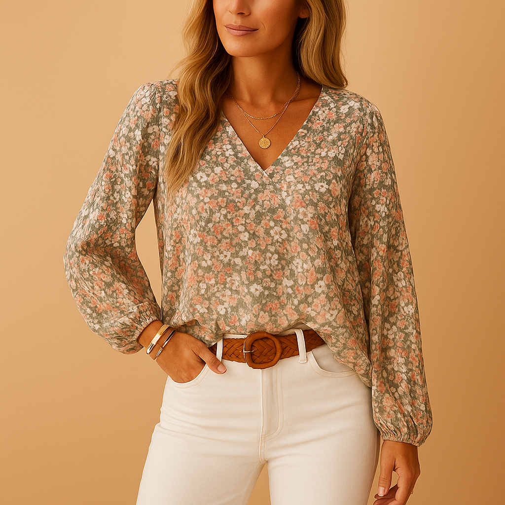 Floral print summer blouse for women in pink, white and green with loose fit and long sleeves, ideal for work, leisure and warm weather outfits.