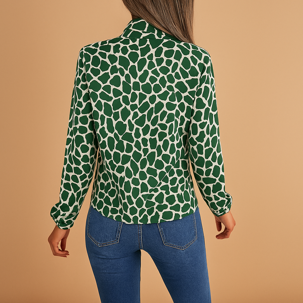 Women’s green polka dot blouse with bow detail and elastic cuffs, ideal for business meetings, office outfits, and smart casual occasions.