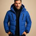 Waterproof winter jacket for men with insulating lining, adjustable hood, and practical pockets, suitable for cold and rainy outdoor use.