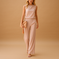 Wide leg jumpsuit for women with a round neck and mid-waist fit, suitable for work, evenings out, and special occasions.